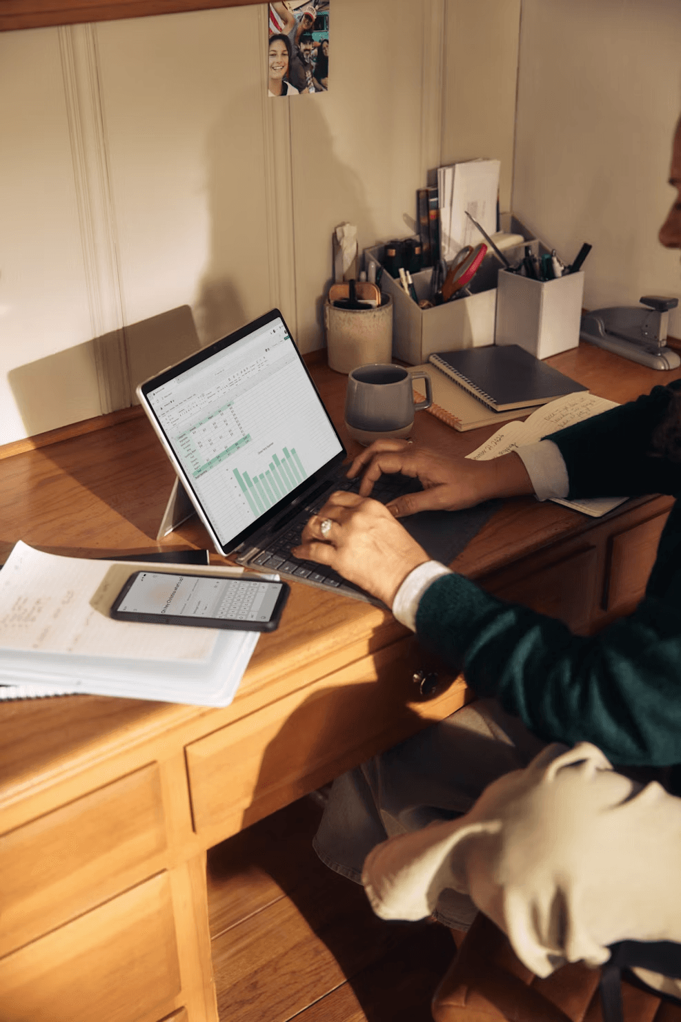 Builder working at their desk, running numbers